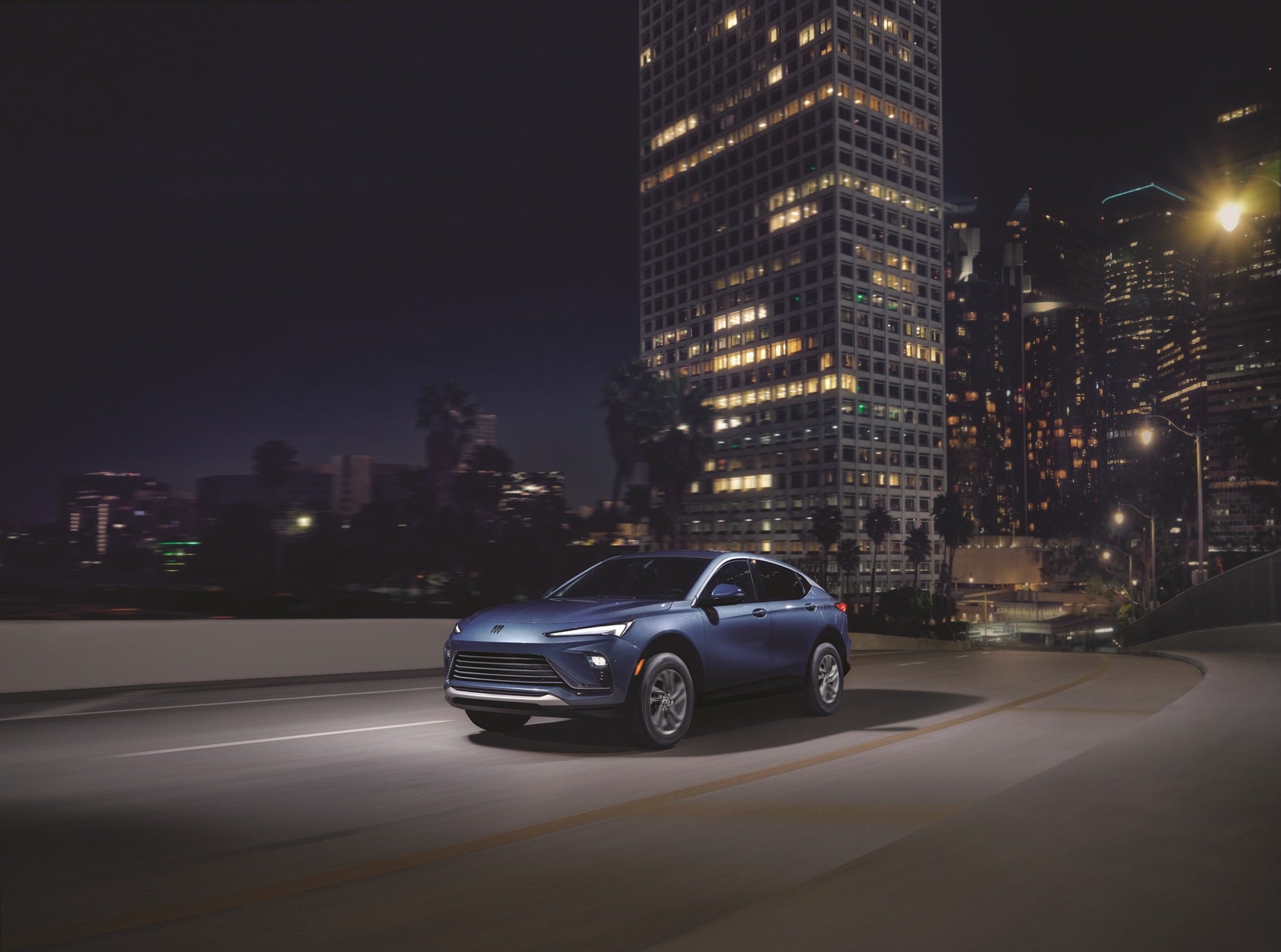 2026 Buick Envista Preferred in Ocean Blue Metallic driving on a highway