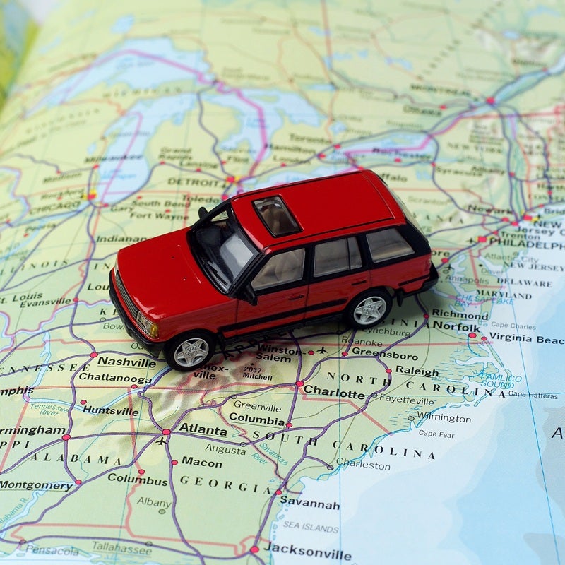 toy car sitting on a map